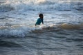 Kovalam, Chennai, Tamilnadu, India - Ã¢â¬Å½Ã¢â¬Å½August 9th Ã¢â¬Å½2021: Young boy Indian surfer surfing and practicing on the beach waves